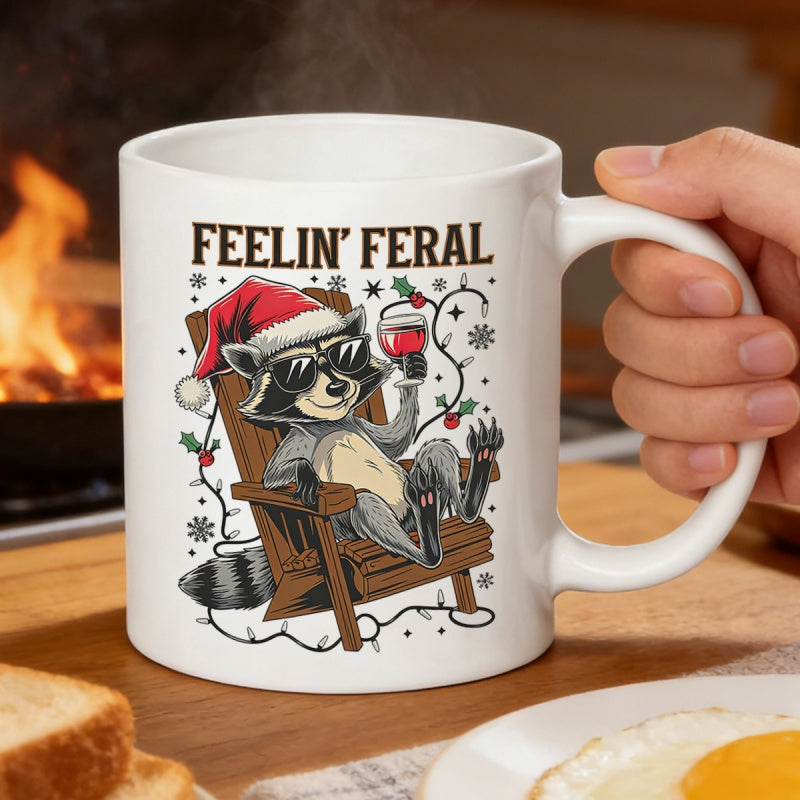 Tailorly White Ceramic 11 oz Mug - Feelin Feral Relaxed Raccoon Wearing Santa Hat And Sunglasses Sitting On Wooden Chair Raccoon