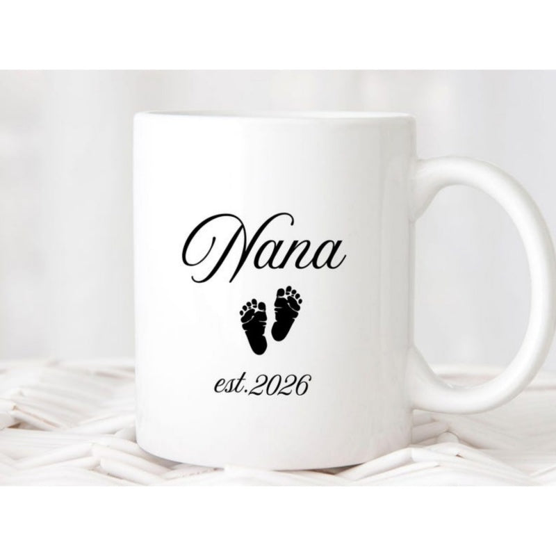Tailorly White Ceramic 11 oz Mug - Nana Est 2026 Tiny Black Baby Feet Silhouettes Printed Neatly On Clean Surface Footprints