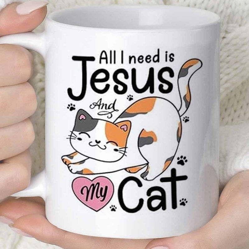 Tailorly White Ceramic 11 oz Mug - All I Need Is Jesus And My Cat Stretching Tricolor Calico Cat Among Floating Paw Prints Under Text Cat