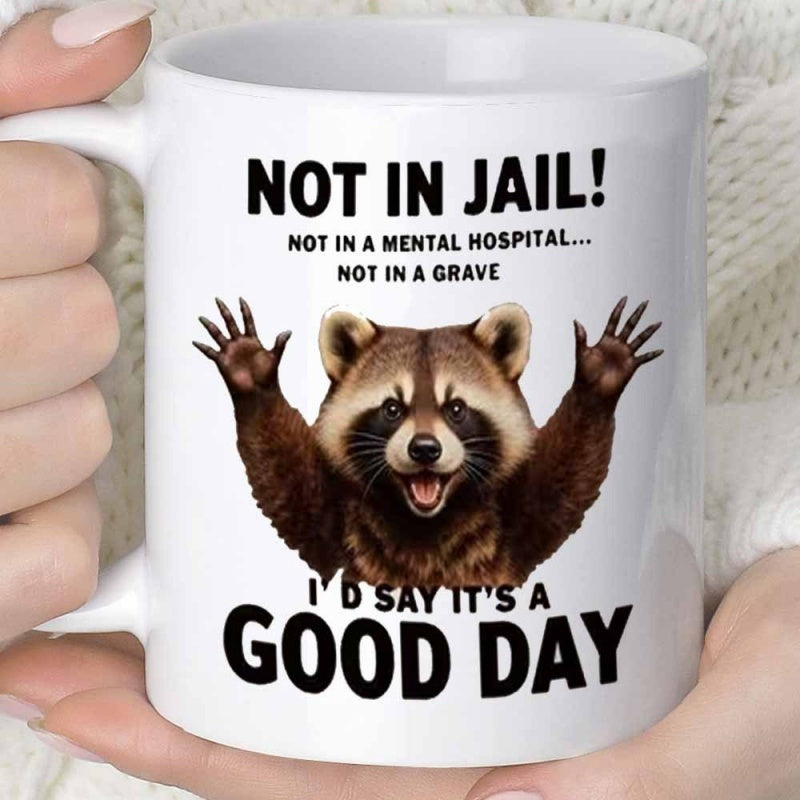 Tailorly White Ceramic 11 oz Mug - Not In Jail Not In A Mental Hospital Not In A Grave Id Say Its A Good Day Cheerful Brown Furry Raccoon Raising Its Little Paws