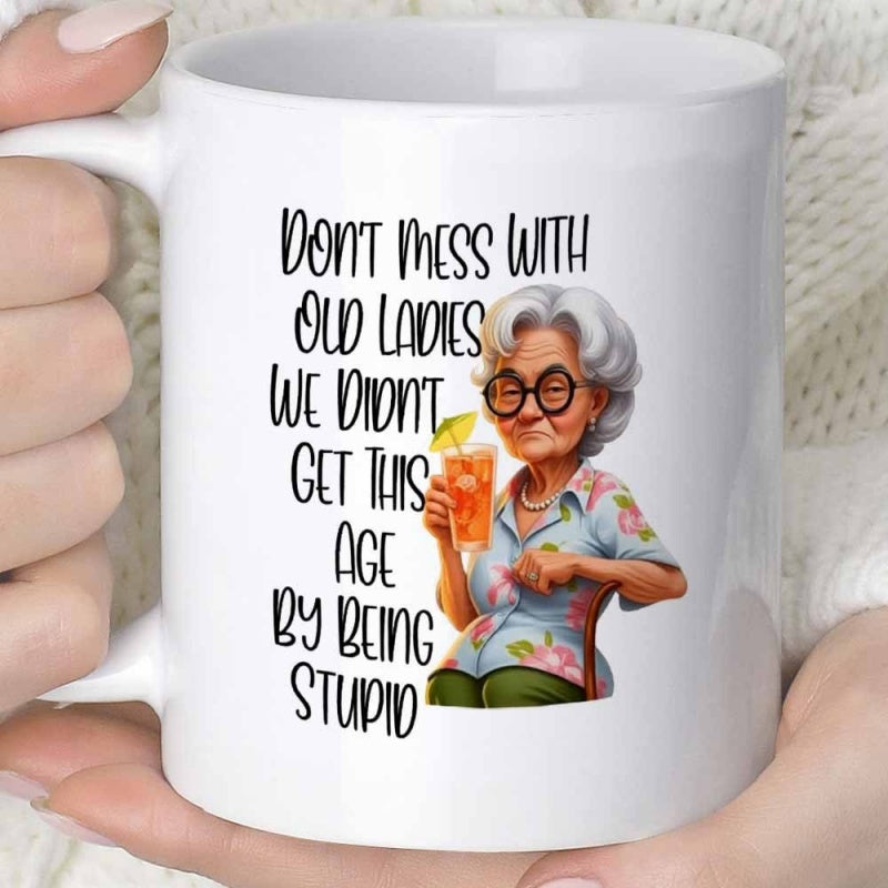 Tailorly White Ceramic 11 oz Mug - Don't Mess With Old Ladies We Didn't Get This Age By Being Stupid Fashionable Elderly Lady Holding Cold Summer Drink Wearing