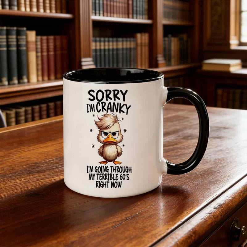 Tailorly Black Accent 11 oz Mug - duck pattern with text "sorry im im going through my 60s"