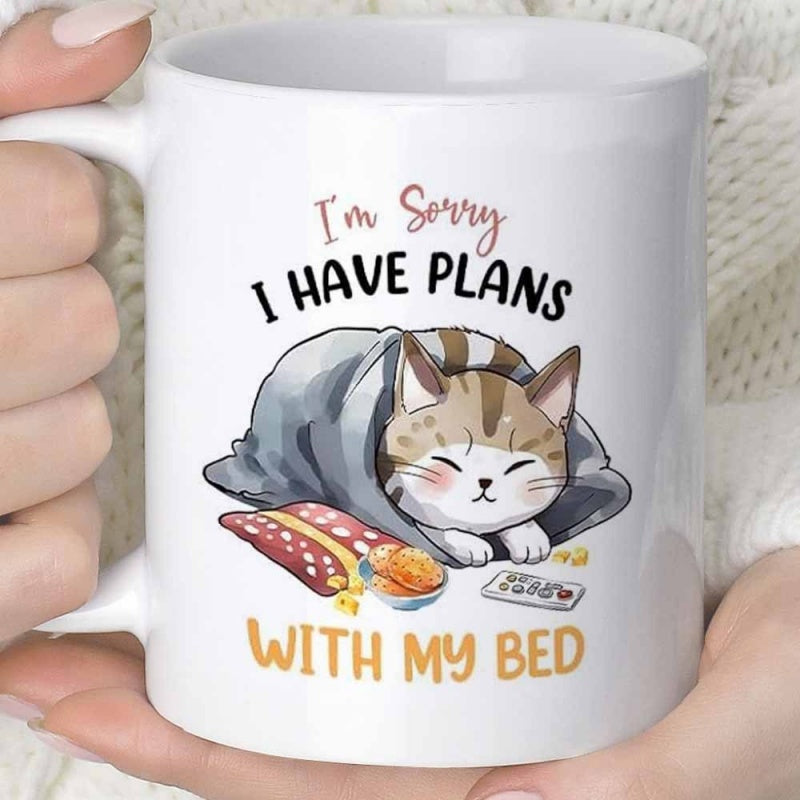 Tailorly White Ceramic 11 oz Mug - Im Sorry I Have Plans With My Bed Cozy Tabby Cat Wrapped In Soft Blue Blanket Under Warm Light Cat