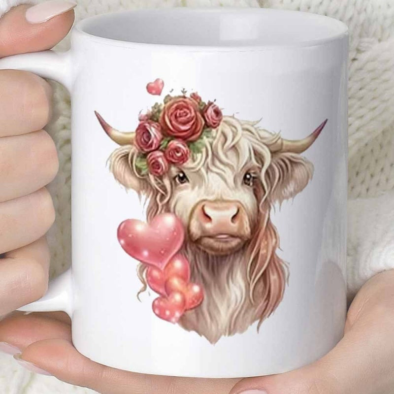 Tailorly White Ceramic 11 oz Mug - Shaggy Cow Wearing Elegant Red Rose Crown Beside Floating Pink Hearts Highland Cow