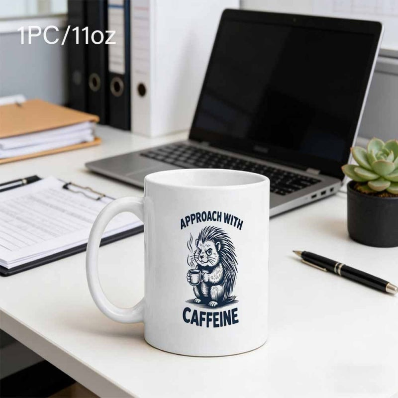 Tailorly White Ceramic 11 oz Mug - Approach With Caffeine Grumpy Little Hedgehog Holding A Hot Steaming Cup Of Coffee Hedgehog