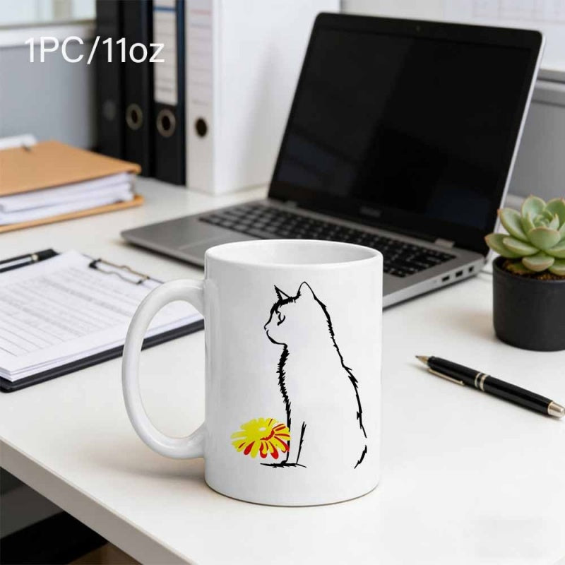 Tailorly White Ceramic 11 oz Mug - Minimalist Black Ink Stroke Outline Sitting Beside A Bright Yellow Flower Cat