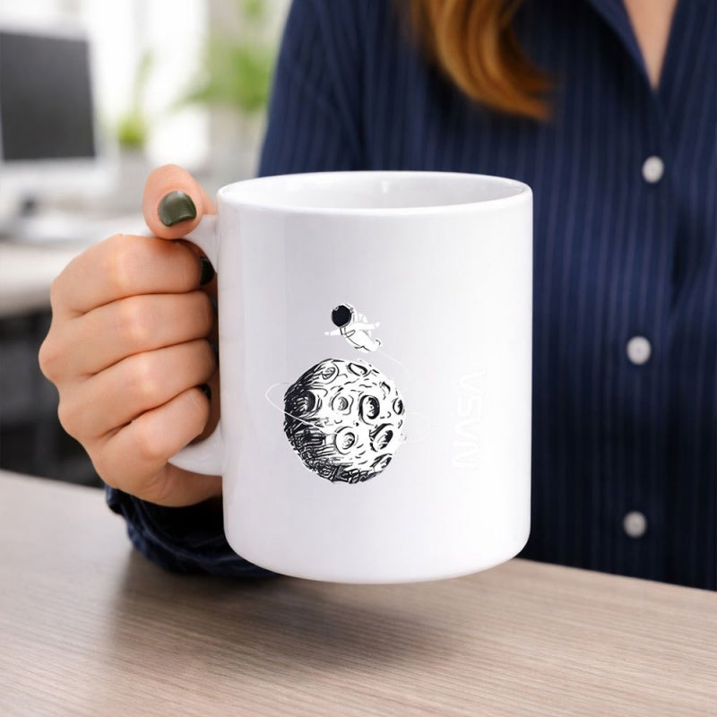 Tailorly White Ceramic 11 oz Mug - Tiny Figure Floating Through Space Above A Craters Covered Moon Astronaut