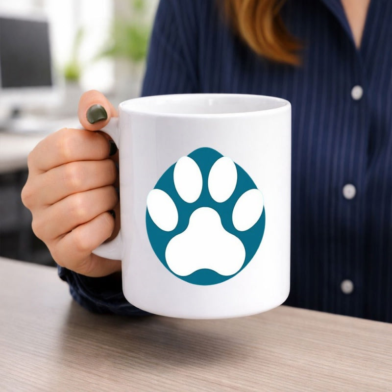 Tailorly White Ceramic 11 oz Mug - Circular Teal Background Featuring A Simple Minimalist White Animal Paw