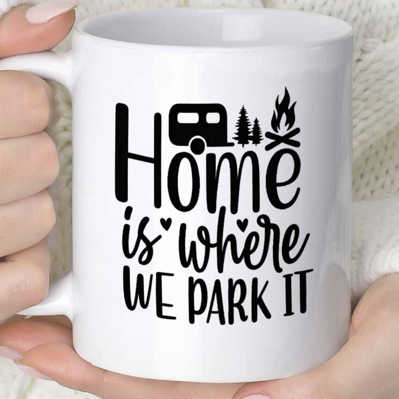 Tailorly White Ceramic 11 oz Mug - Home Is Where We Park It Minimalist Black Silhouette Featuring A Small Camper Among Pines And Campfire Trailer