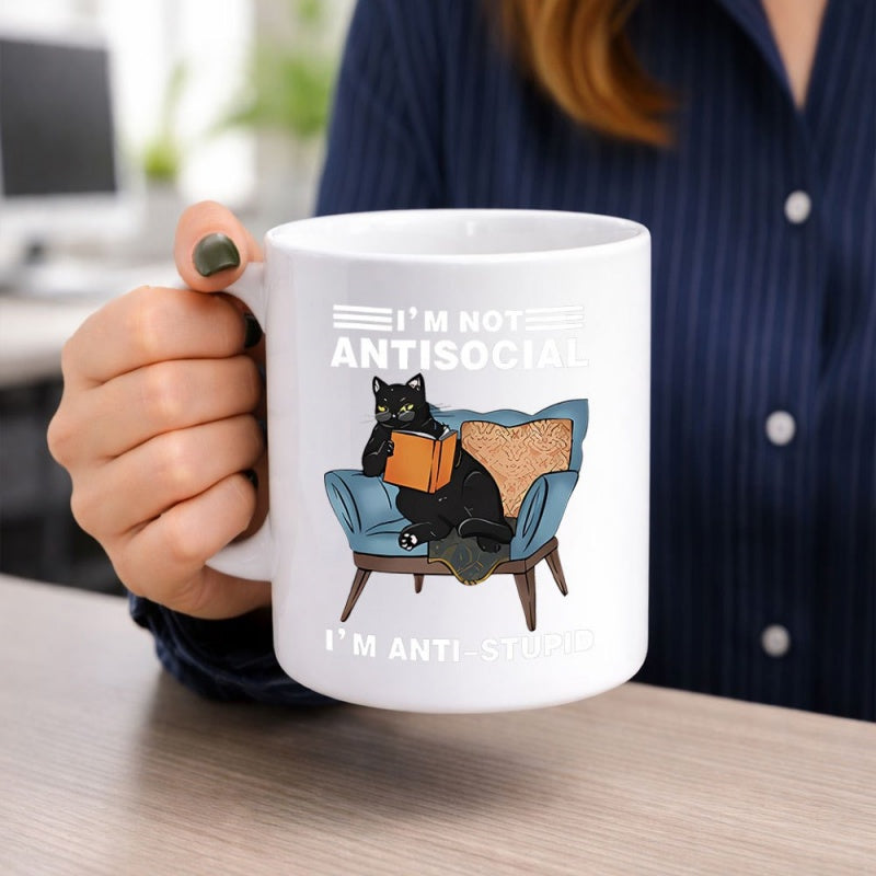 Tailorly White Ceramic 11 oz Mug - Im Not Antisocial Im Anti Stupid Grumpy Black Furry Friend Sitting In Comfy Armchair Reading Book Cat