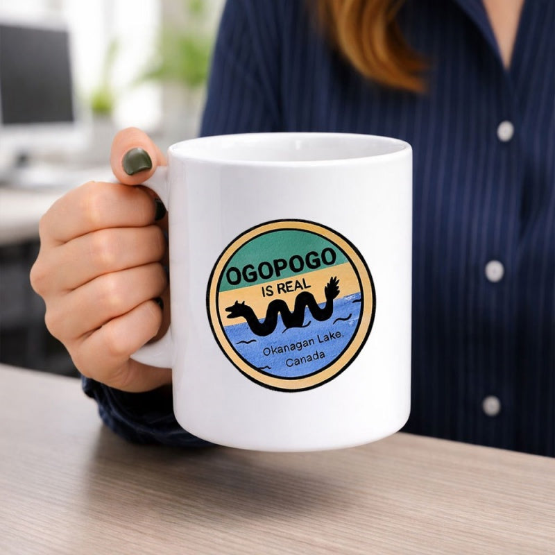 Tailorly White Ceramic 11 oz Mug - Ogopogo Is Real Okanagan Lake Canada Mythical Wavy Creature Swimming In Blue Rippling Water Inside Circular Badge Serpent