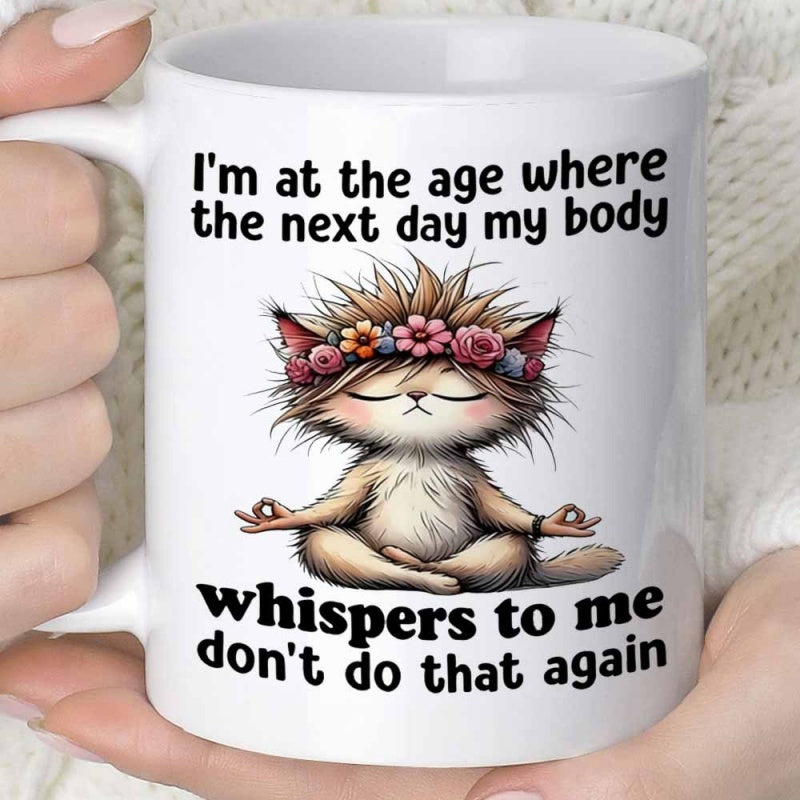 Tailorly White Ceramic 11 oz Mug - Im At The Age Where The Next Day My Body Whispers To Me Dont Do That Again Fluffy Messy Haired Meditating Creature Wearing A