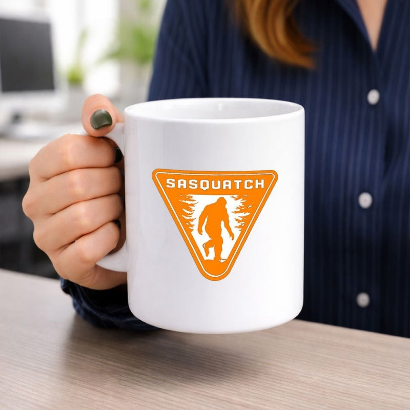 Tailorly White Ceramic 11 oz Mug - Sasquatch Walking Through Forest Inside Orange Inverted Triangle Sign Sasquatch