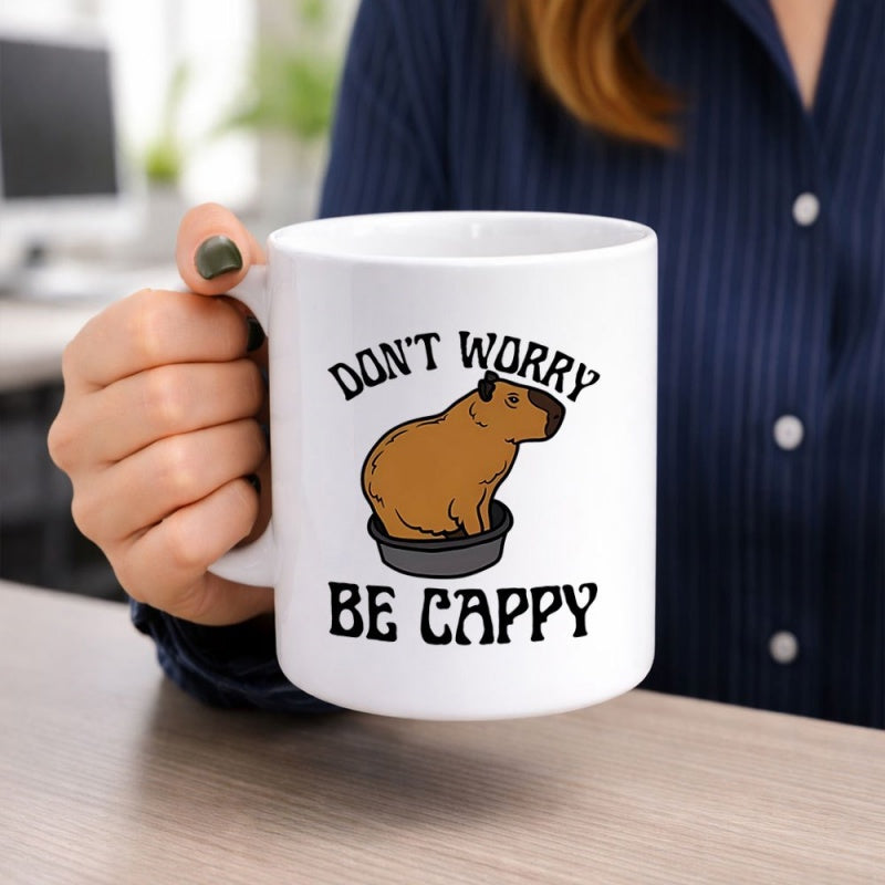 Tailorly White Ceramic 11 oz Mug - Dont Worry Be Cappy Brown Cartoon Capybara Sitting Inside A Black Bowl With Minimalist Lines Capybara