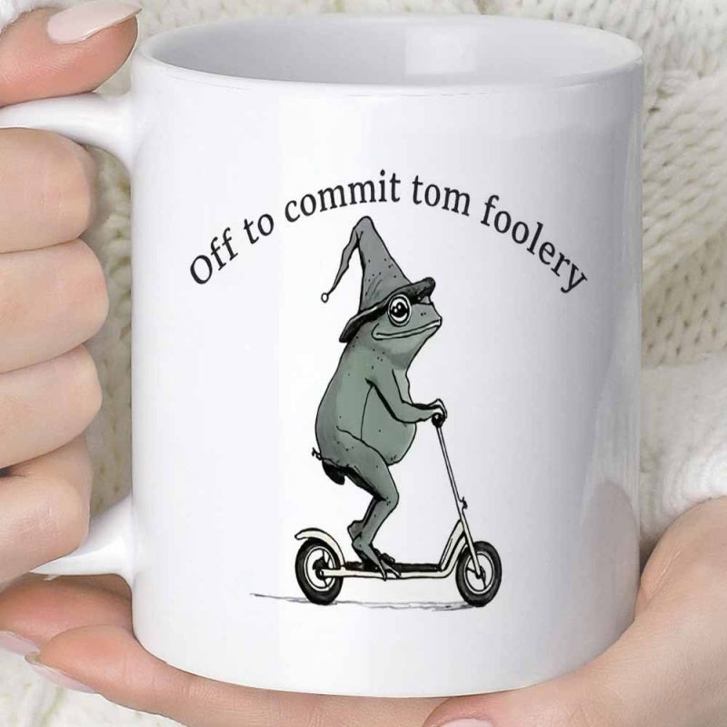 Tailorly White Ceramic 11 oz Mug - Off To Commit Tom Foolery Whimsical Green Frog Wearing Wizard Hat Riding A Small Kick Scooter Frog