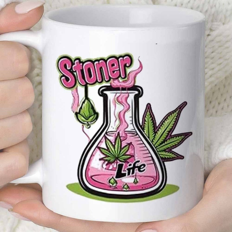 Tailorly White Ceramic 11 oz Mug - Stoner Life Scientific Beaker Filling With Pink Liquid Among Green Cannabis Leaves Flask