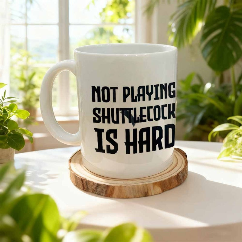 Tailorly White Ceramic 11 oz Mug - Not Playing Shuttlecock Is Hard Elegant White Ceramic Vessel Sitting On Round Wooden Base Mug