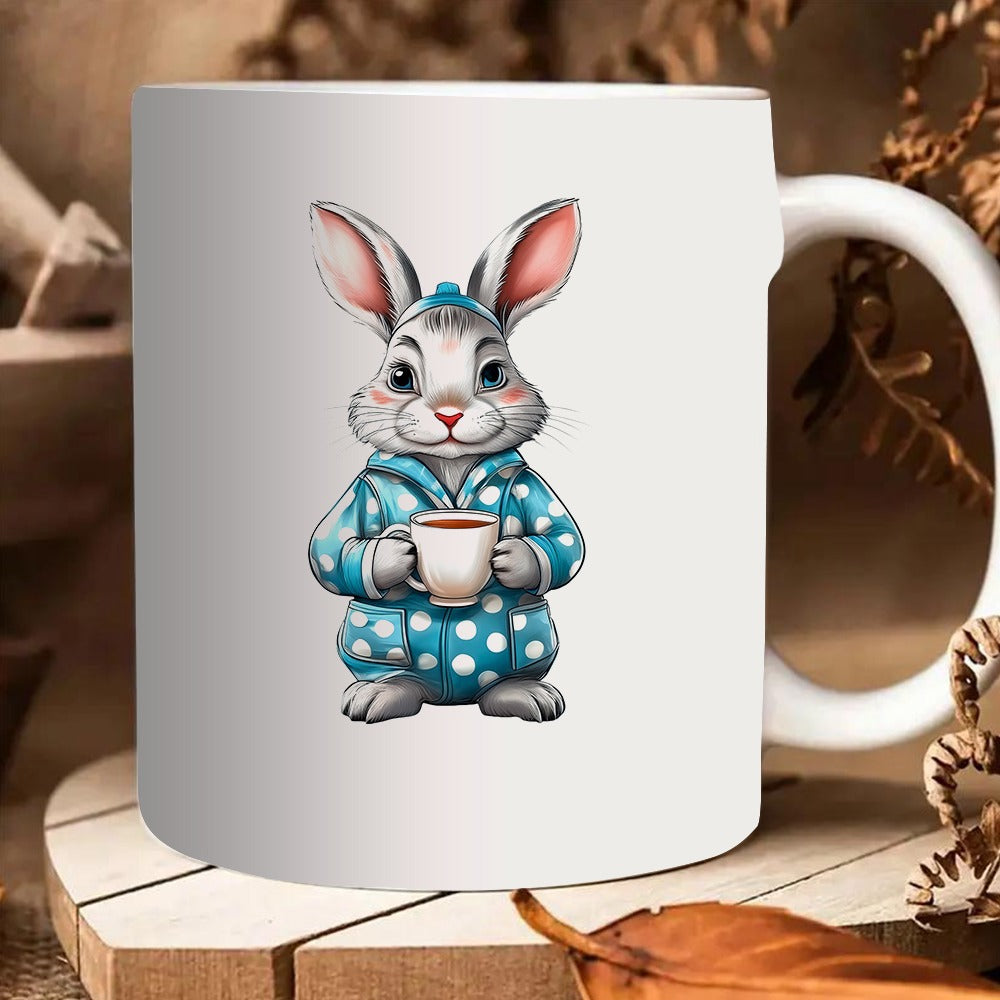 Tailorly White Ceramic 11 oz Mug - an adorable rabbit dressed in polka dot pajamas holding a tea cup
