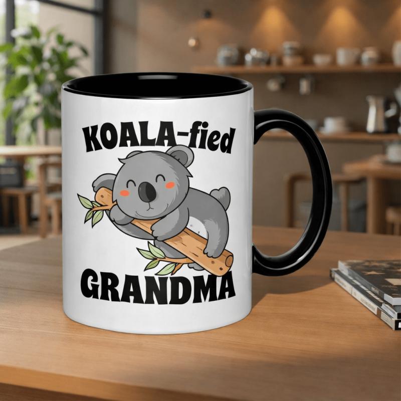 Tailorly Black Accent 11 oz Mug - adorable koala grandma embracing a tree limb