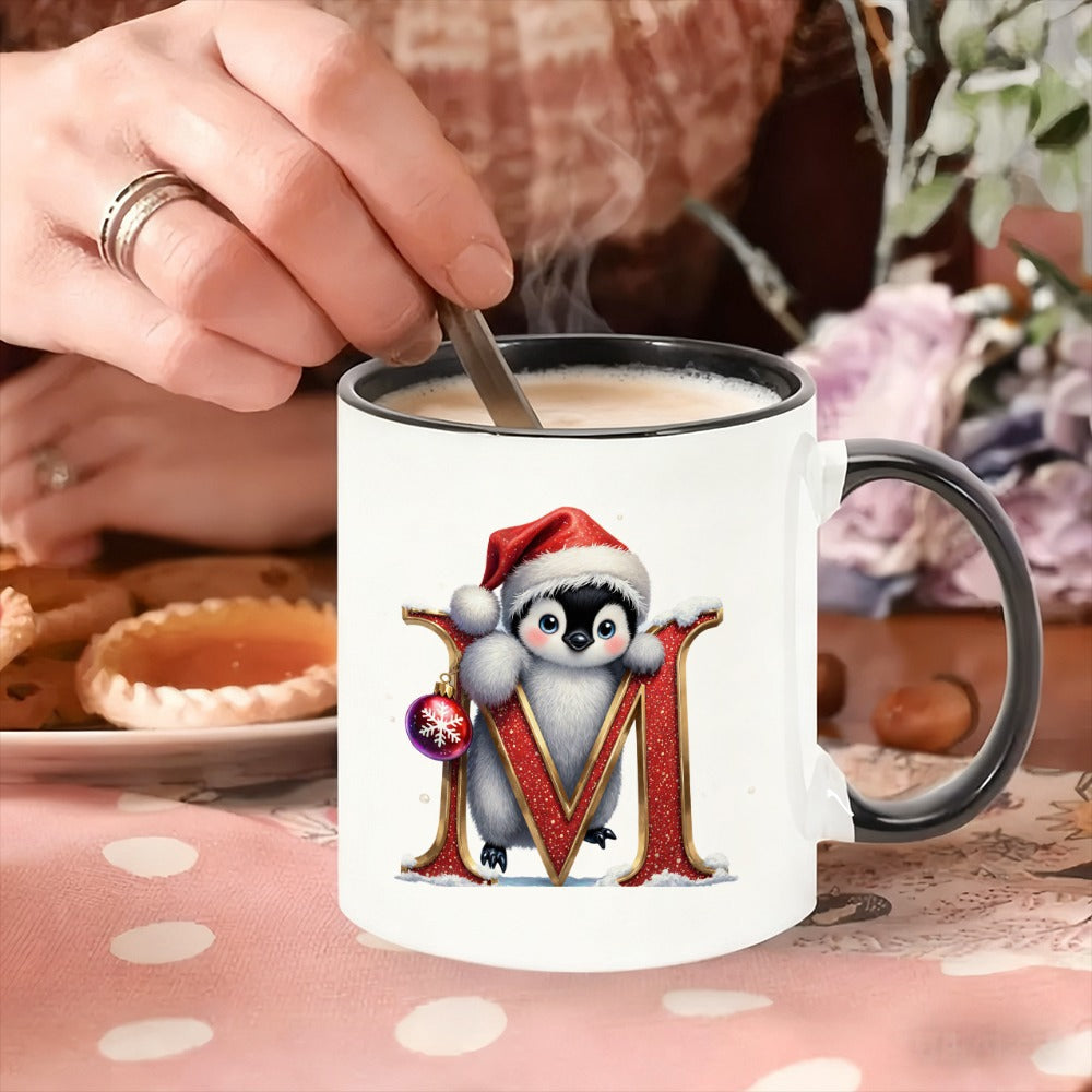 Tailorly Black Accent 11 oz Mug - adorable penguin in a santa hat grasping a red letter m