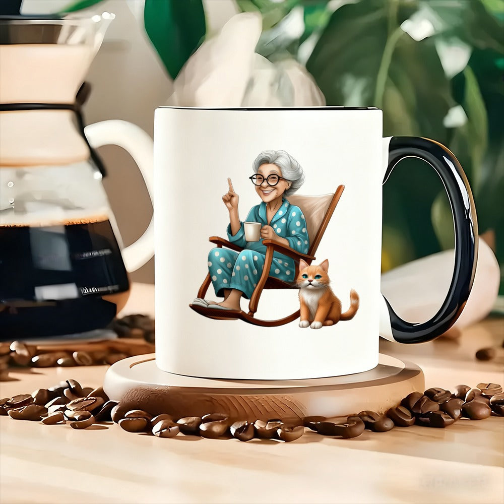 Tailorly Black Accent 11 oz Mug - an elderly woman with a cat dressed in polka dot pajamas sitting in a rocking chair