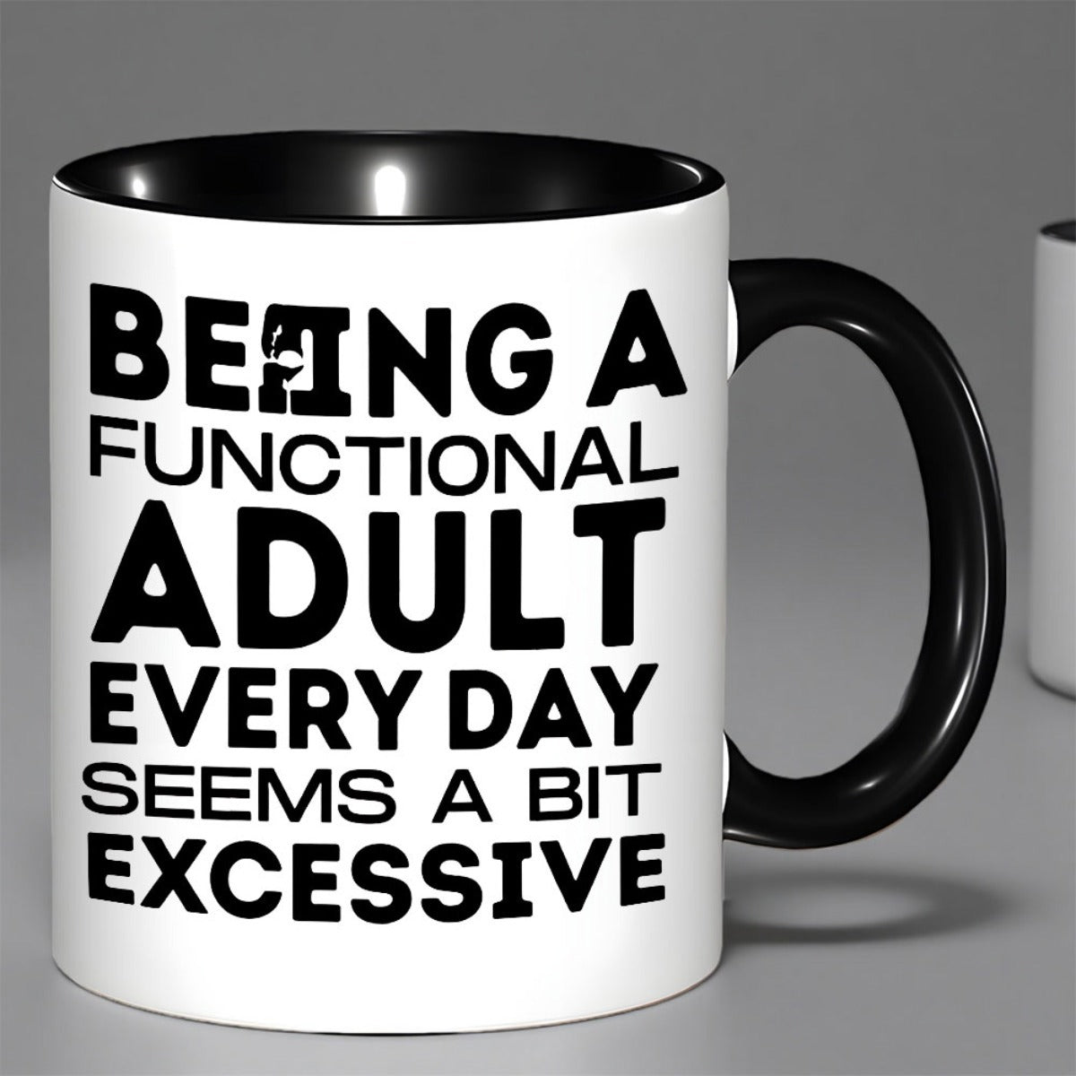 Tailorly Black Accent 11 oz Mug - black words on white background with green handle