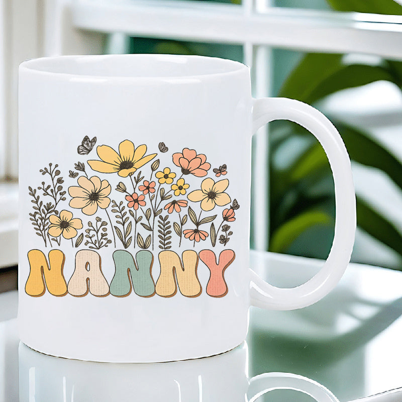 Tailorly White Ceramic 11 oz Mug - floral nanny letter pattern